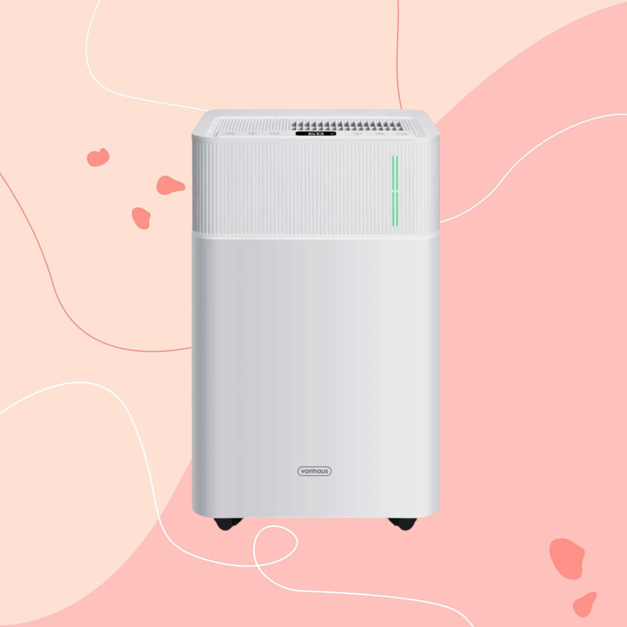 Vonhaus portable 20L dehumidifier on a pink graphic background