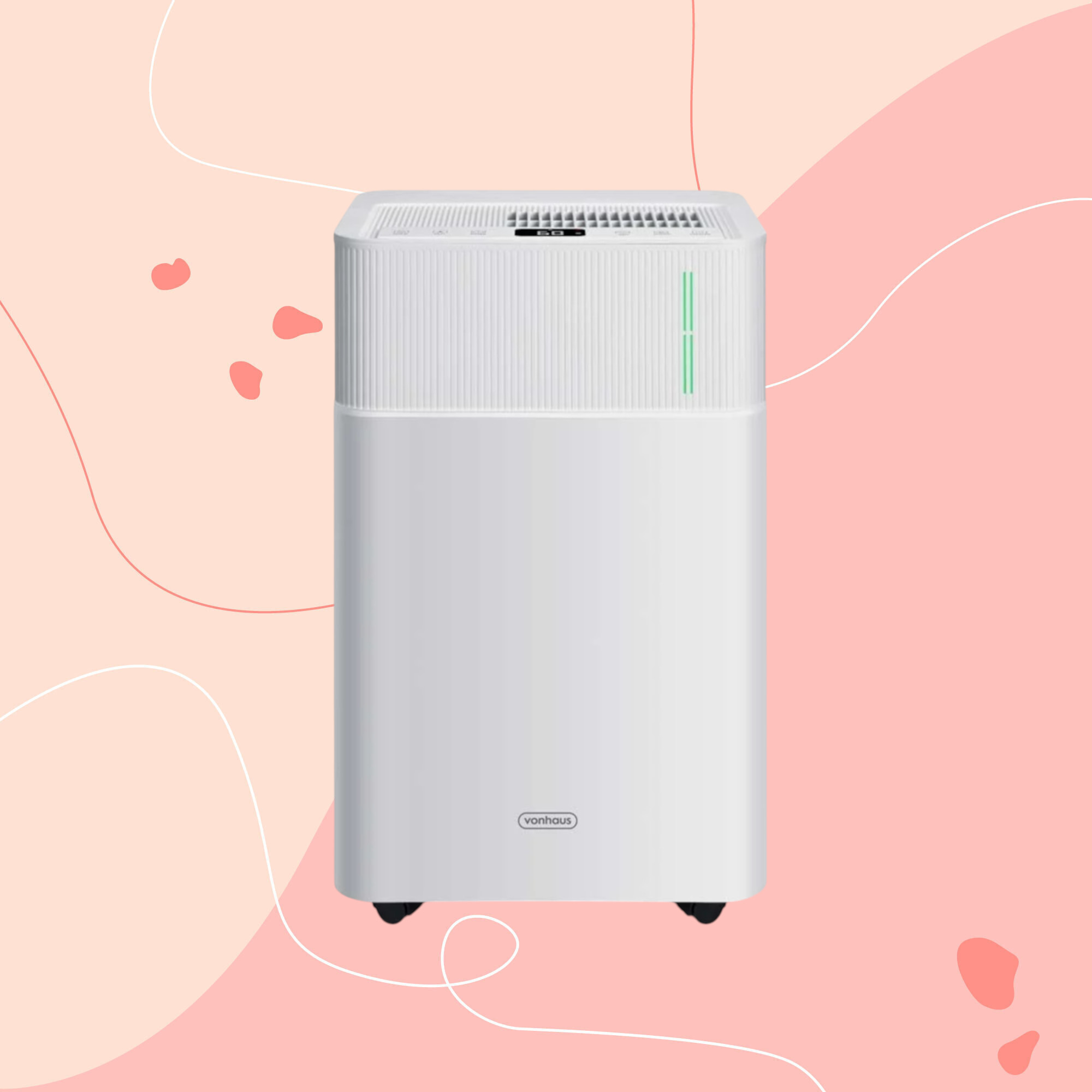 Vonhaus portable 20L dehumidifier on a pink graphic background