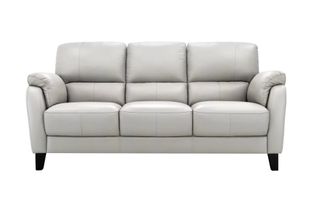 A pale gray leather sofa with black feet