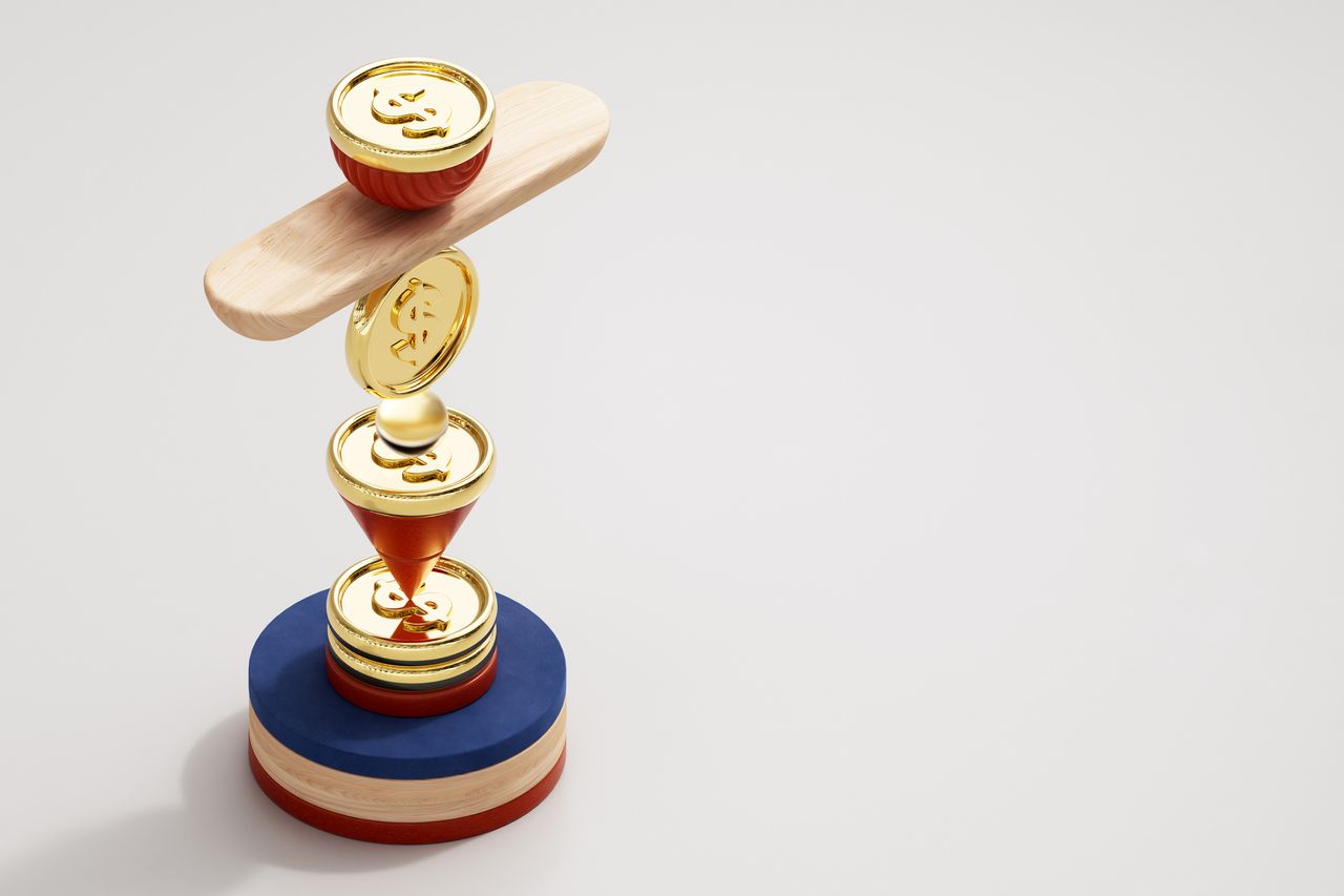 digital image of gold coins with dollar signs being balanced on top of a blue, tan and red wooden circle