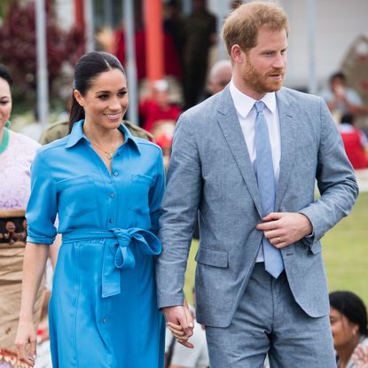 Prince Harry and Meghan Markle walk hand in hand