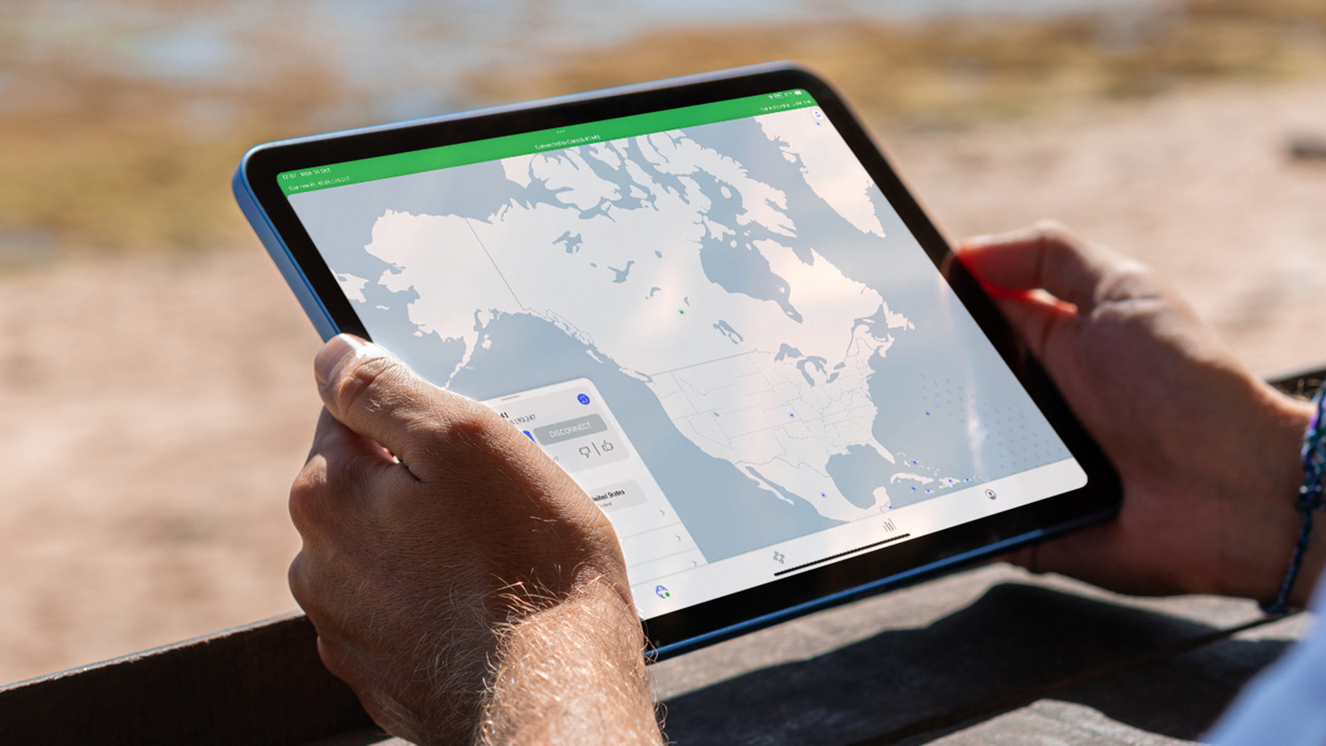 NordVPN app on mobile device, being used on the beach