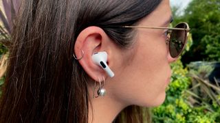 A person wearing the AirPods Pro 2