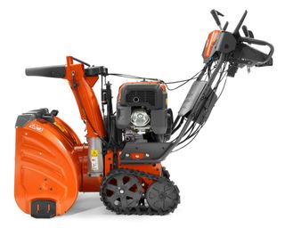 side on image of the Husqvarna ST 430T snow blower in red