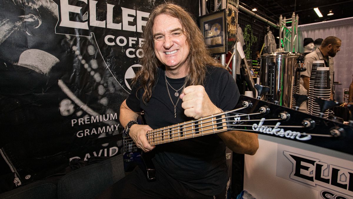 David Ellefson sat down holding a bass guitar