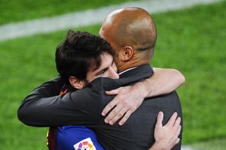 Lionel Messi embraces Pep Guardiola after scoring Barcelona's third goal in a 4-0 win over Espanyol in May 2012.
