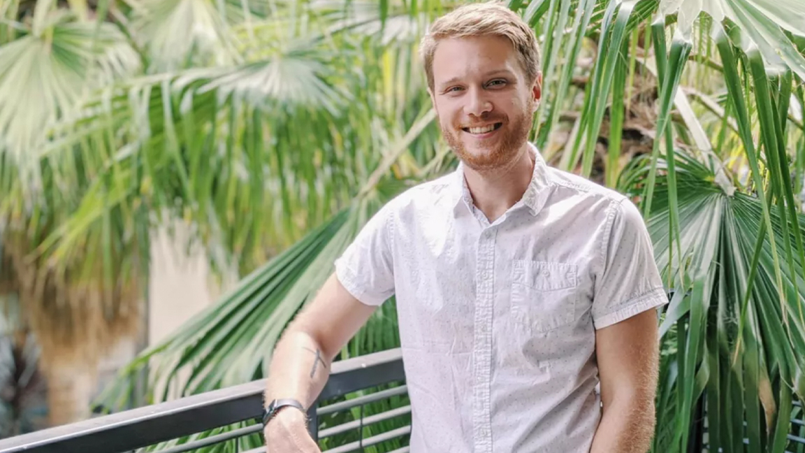 NVIDIA GeForce RTX 4090 Series GPU; a photo of a man against a fence