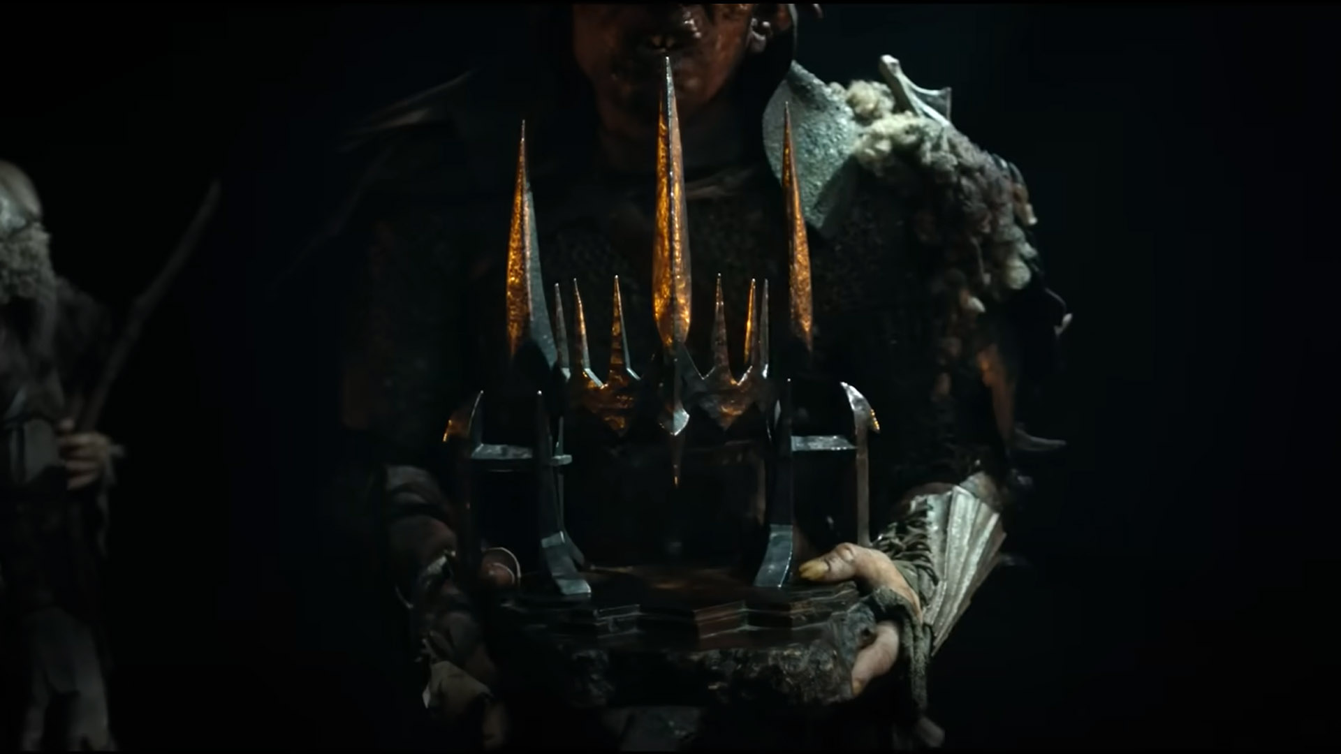 An orc carries Morgoth's crown in The Rings of Power season 2