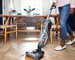 VAX ONEPWR Glide All The Power No Cord vacuum used in a dining room - VAX