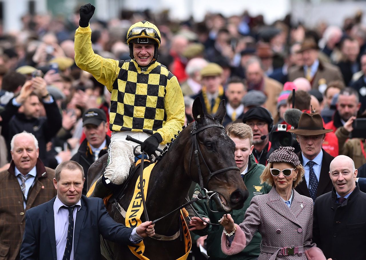 Irish jockey Paul Townend on Al Boum Photo reacts after winning the Gold Cup race on the final day of the Cheltenham Festival, March 15, 2019. Credit: Glyn KIRK / AFP via Getty Images