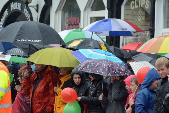 Umbrellas were the order of the day at the start of stage 5