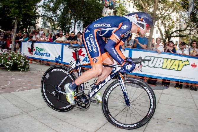Craig Lewis (Champion System) heads out through the fan-lined streets.