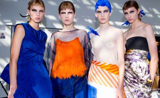 Models wear blue dress, orange top with blue skirt, white see through top with orange striped skirt, and white, black and purple dress
