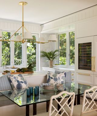 white kitchen with large island with seating area