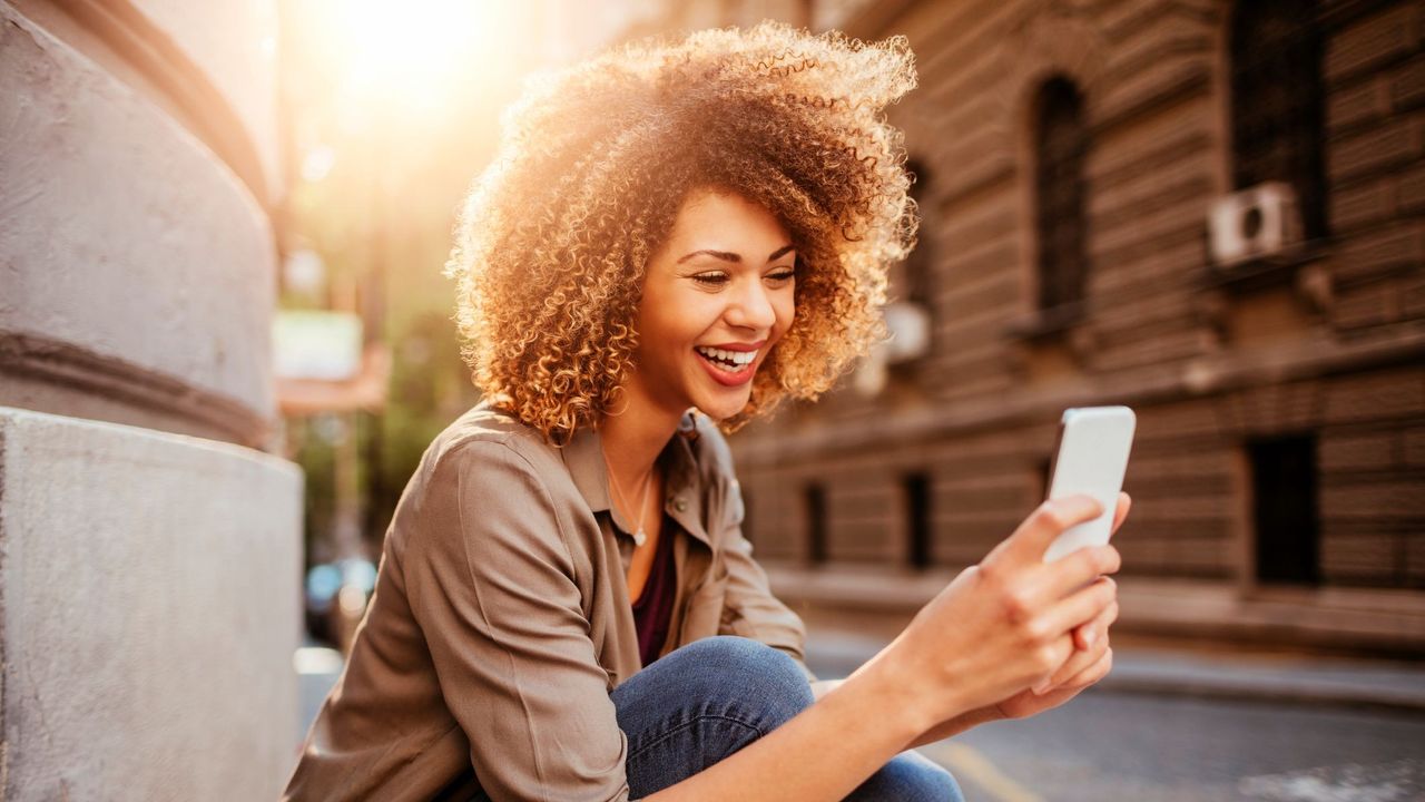 woman smiling on phone