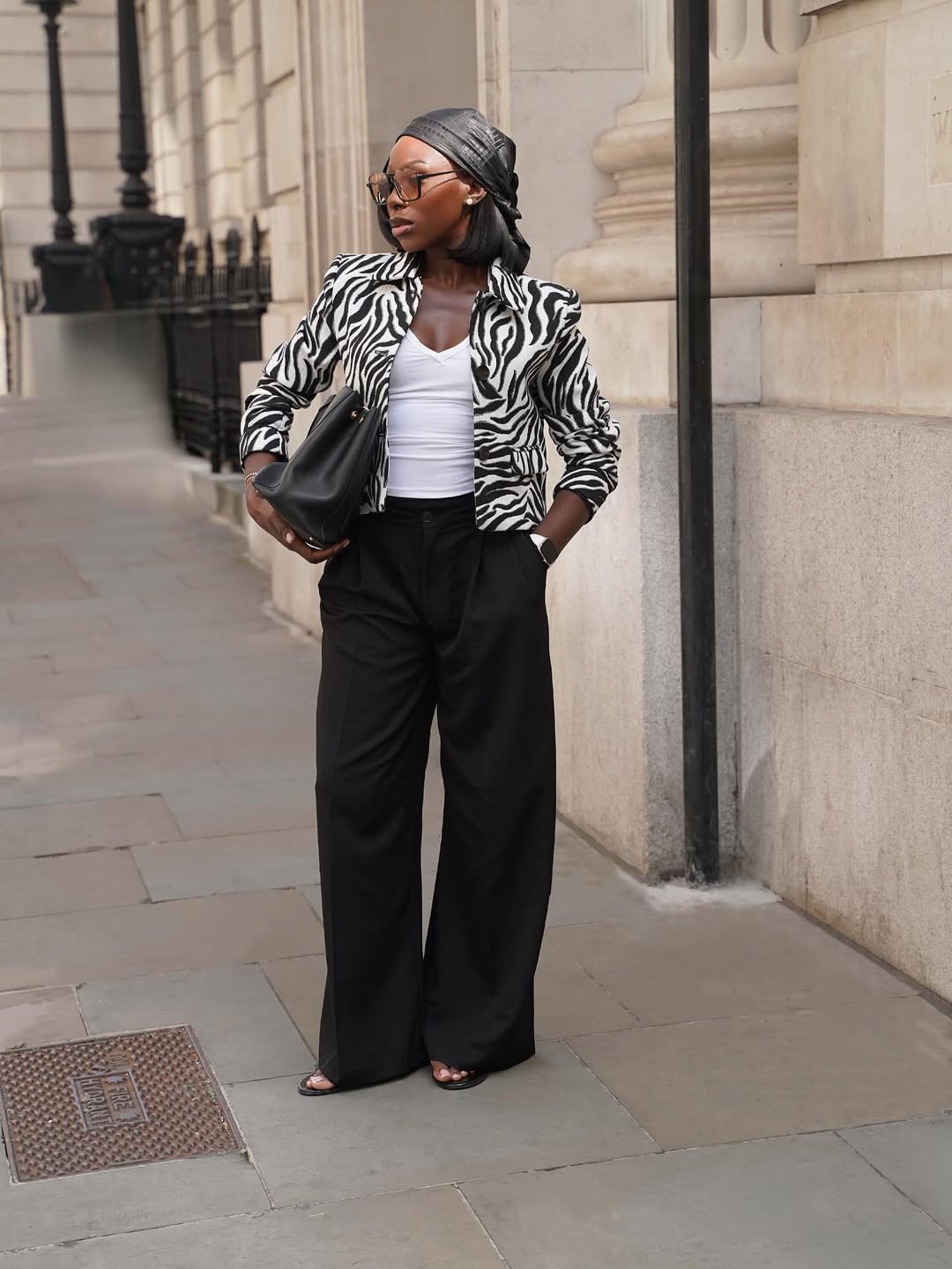 @amagodson_a wears zebra print jacket, black trousers