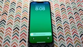 iOS 16 Home app notification displayed on an iPhone 13 Pro Max