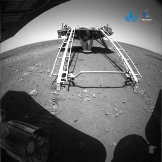 The lander for China's Mars rover Zhurong is seen from the Martian surface for the first time in this image from the rover's rear hazard avoidance camera on May 21, 2021.