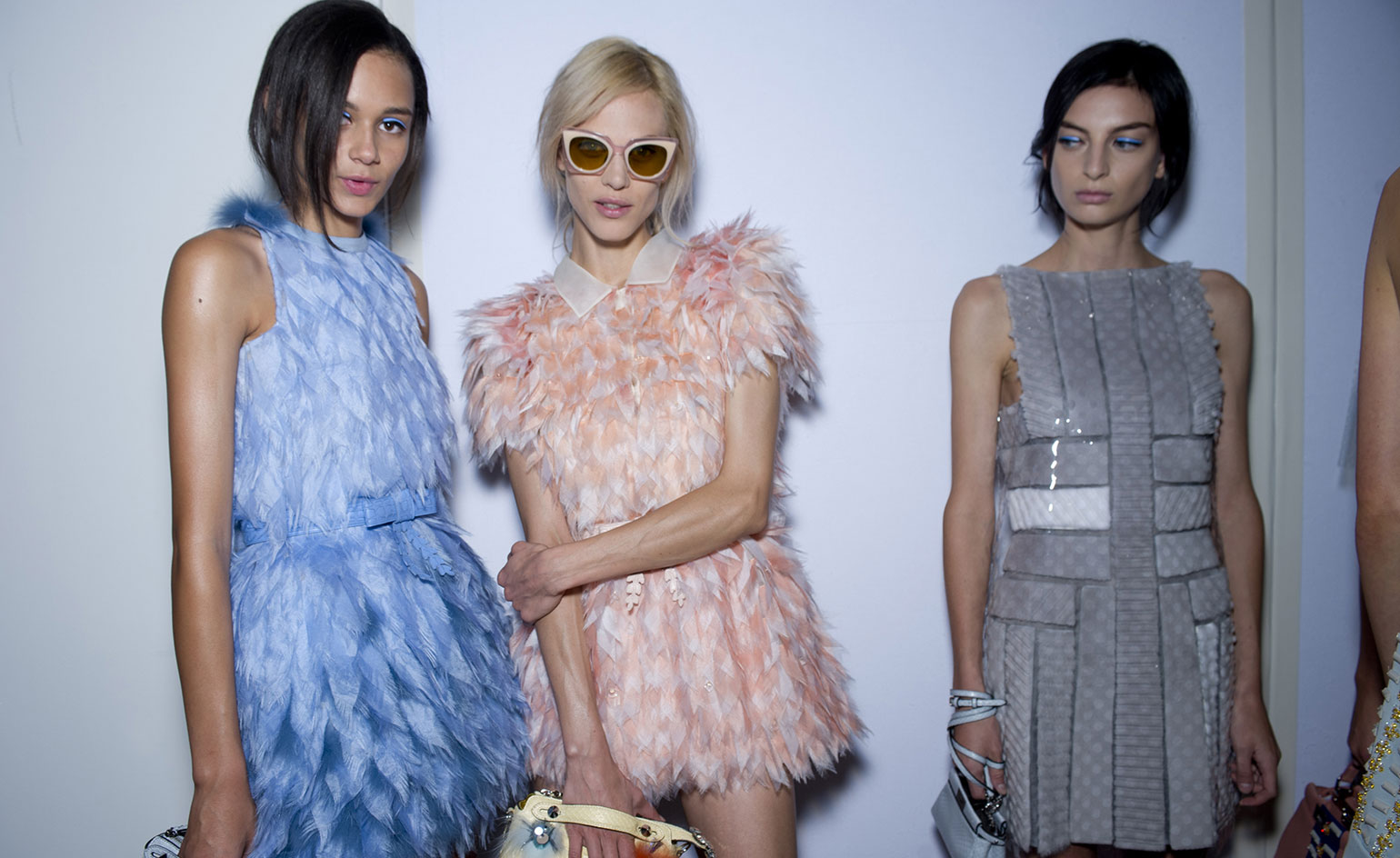 The models' hair like a feathered Indian princess headdress.