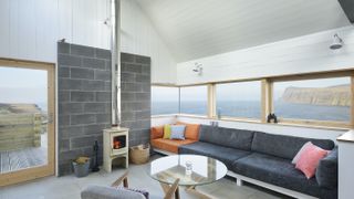 contemporary living room with log burner and views