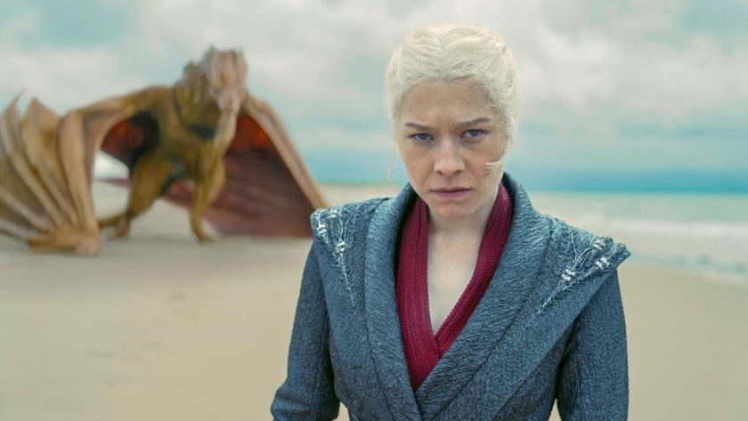 Rhaenyra (Emm D&#039;Arcy) stands on a beach with her dragon, Syrax, in the background in &quot;House of the Dragon&quot; season 2