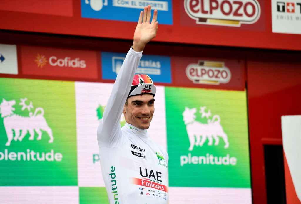 Team UAE Spanish rider Juan Ayuso Pesquera wearing the Youth jersey celebrates on the podium after the stage 13 of the 2023 La Vuelta cycling tour of Spain a 1347 km race between Formigal and the Col du Tourmalet in France on September 8 2023 Photo by ANDER GILLENEA AFP Photo by ANDER GILLENEAAFP via Getty Images