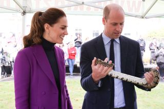 Prince William Kate Middleton Catherine, Duchess of Cambridge observes as Prince William, Duke of Cambridge handles a snake during their tour of the Ulster University Magee Campus on September 29, 2021 in Londonderry, Northern Ireland. (Photo by Chris Jackson/Getty Images)