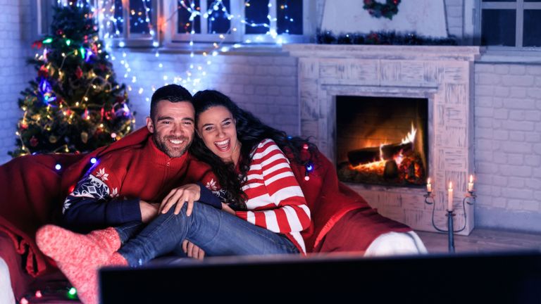 Couple watching Christmas films