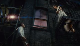 Tony and Maria stand on their balconies in West Side Story.