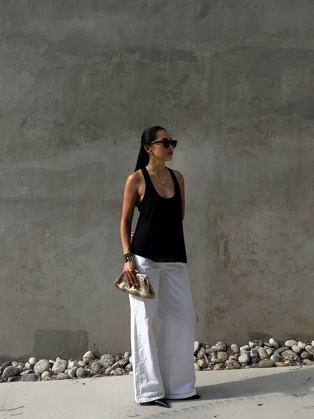 Dawn holding a metallic clutch