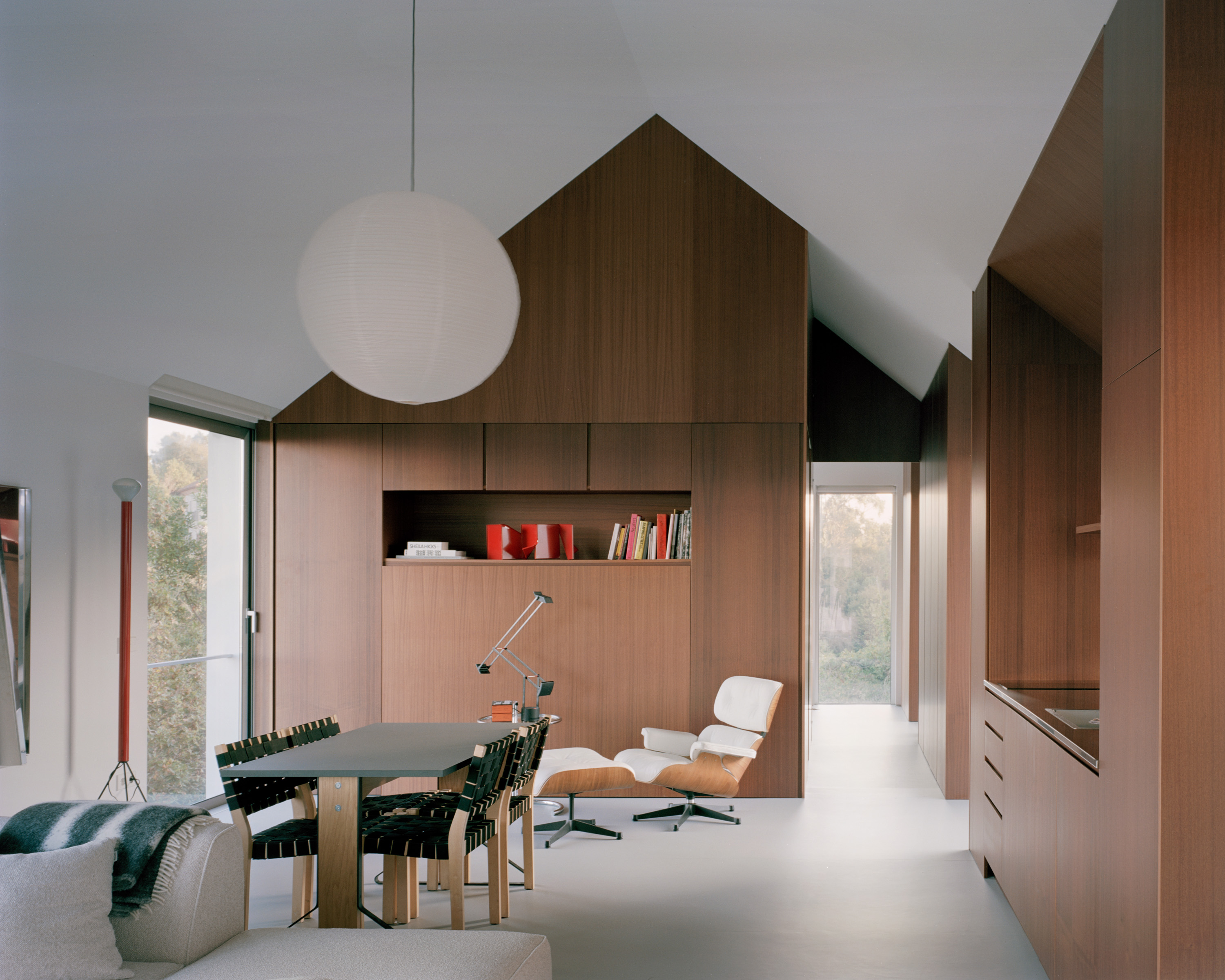 view of minimalist Casa Guadalupe by studio hanghar, a white house with dark timber accents