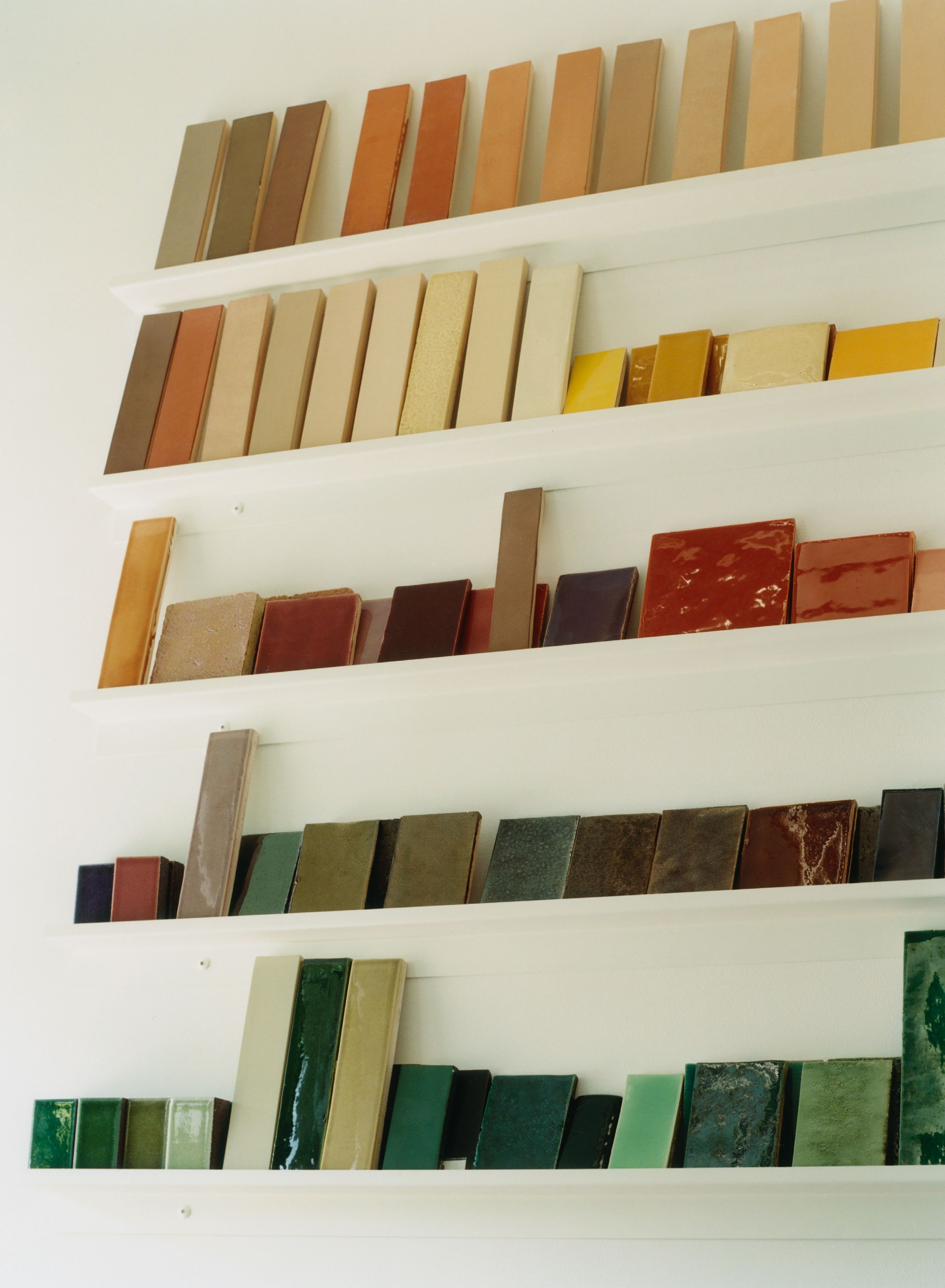 coloured tile samples on shelves