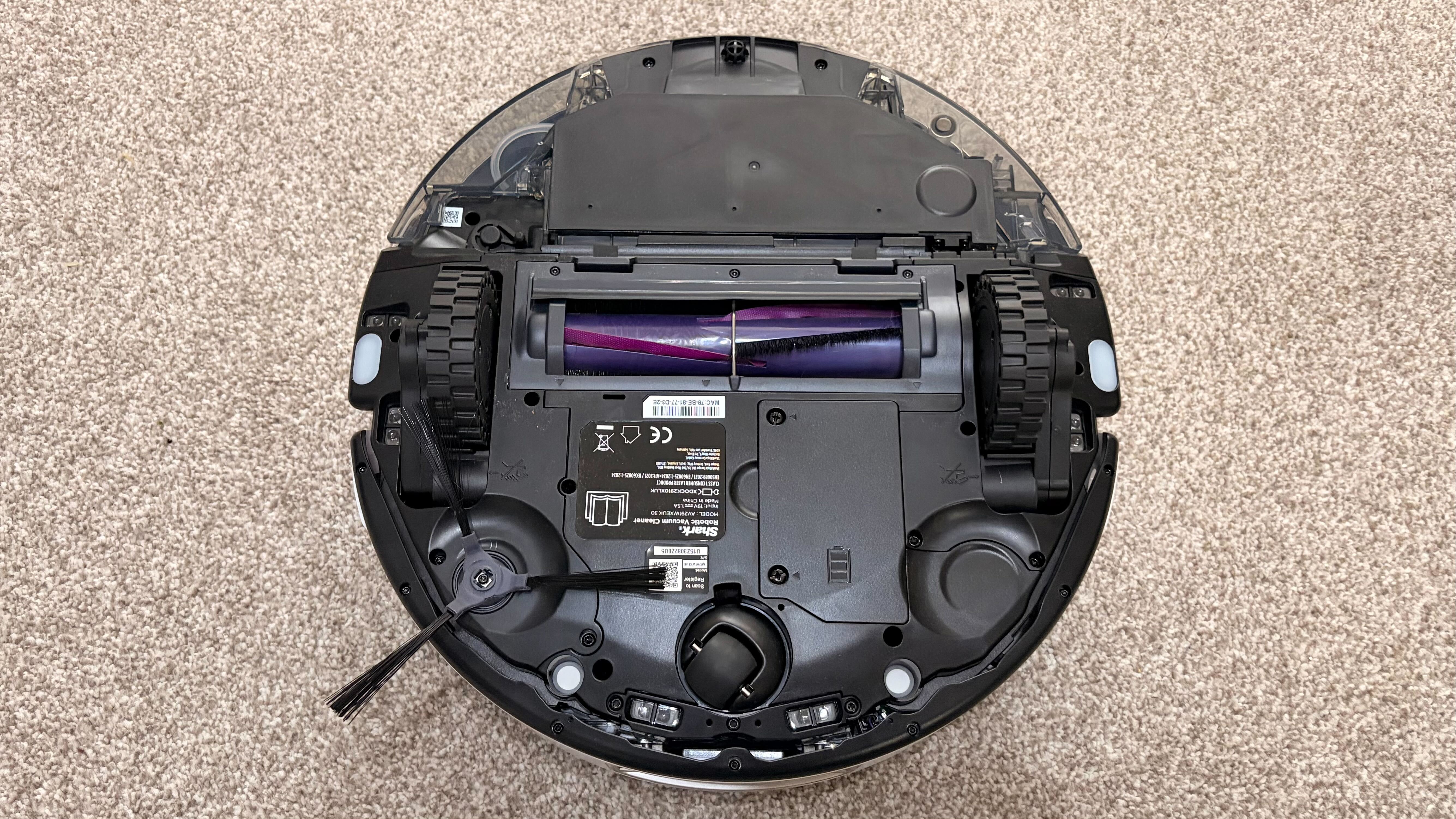 Shark PowerDetect 2-in-1 ThermaCharged NeverTouch photographed on a carpet with docking station