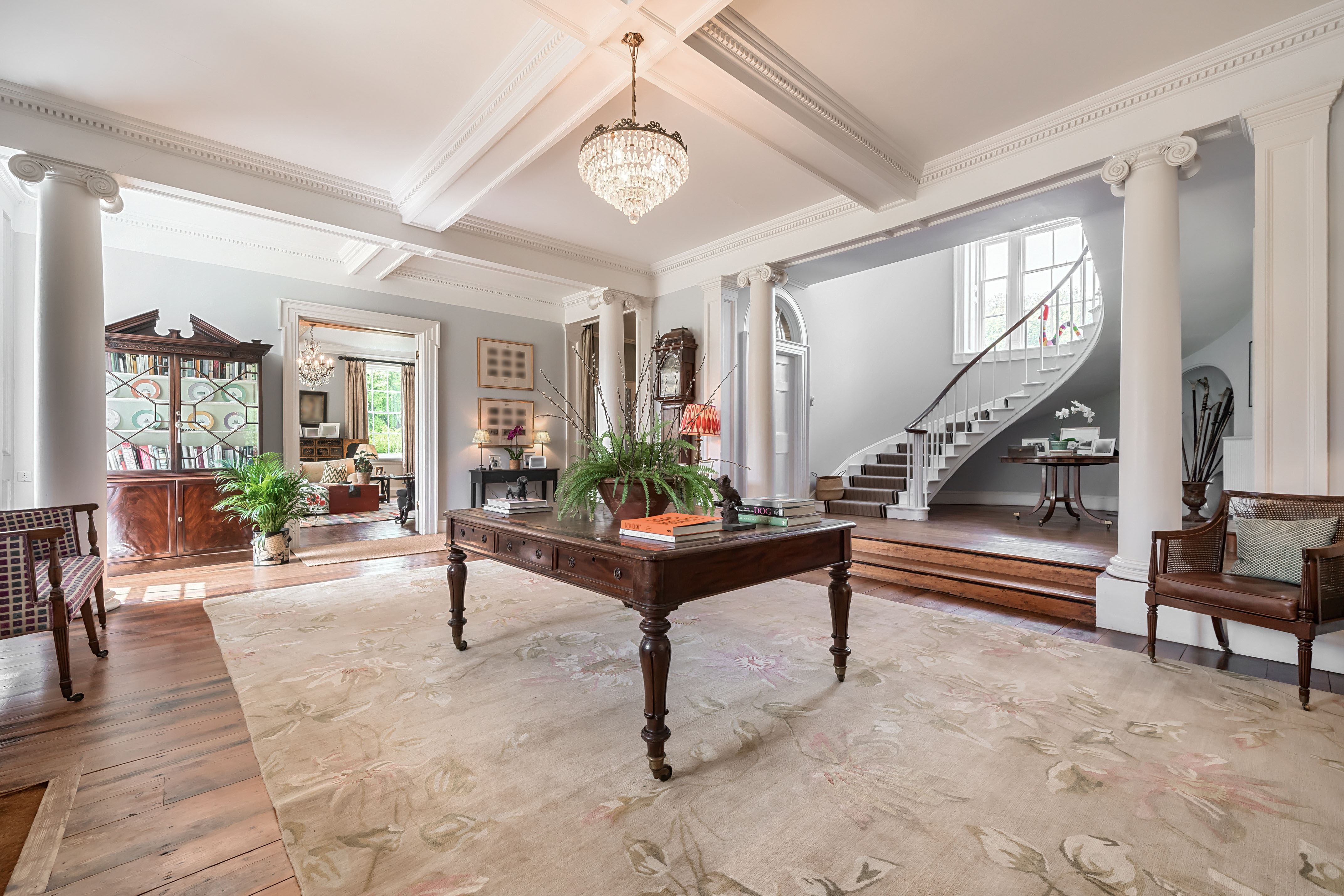 Images of the restored interiors of Polstead Hall, featuring traditional furniture, exposed beams and classical elements