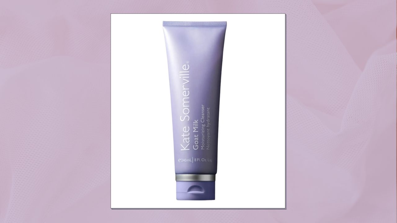 A close up of the Kate Somerville Goat Milk Moisturising Cleanser in a pastel purple, textured template