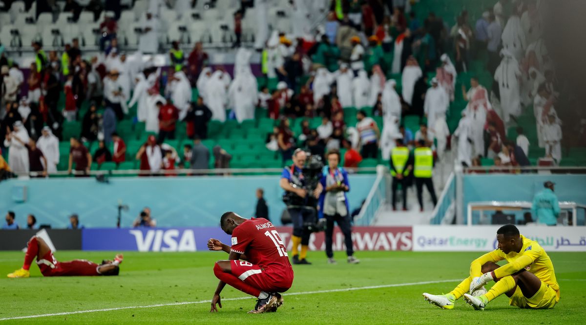 Almoez Ali of Qatar and goalkeeper Meshaal Barsham of Qatar look dejected after the FIFA World Cup Qatar 2022 Group A match between Qatar and Senegal at Al Thumama Stadium on November 25, 2022 in Doha, Qatar.