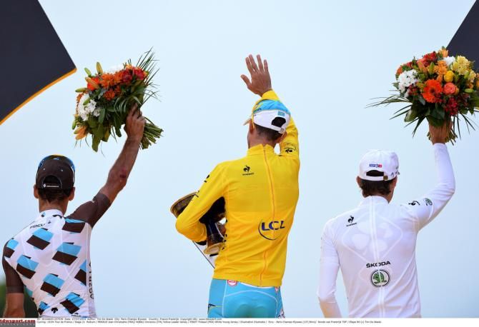 The podium turns to thank the crowd behind them