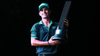 Joaquin Niemann poses with the trophy after his LIV Golf Mayakoba victory