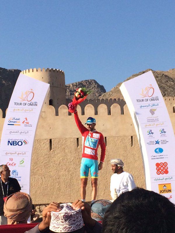 Vincenzo Nibali pulls on the red leader's jersey