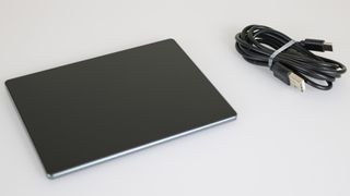 The Seenda Upgraded Trackpad next to the included USB-C cable