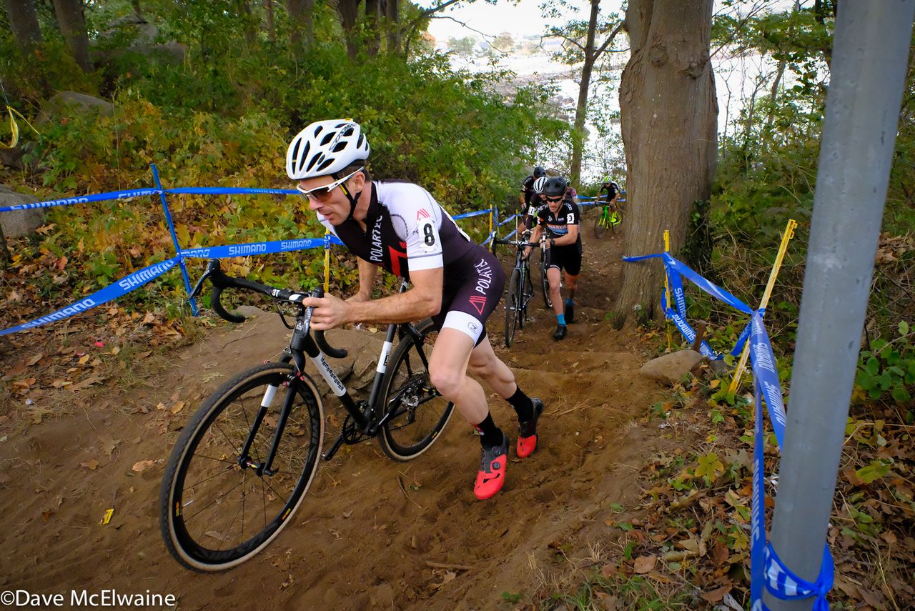 Dylan McNicholas (Polartec) leading on a run-up at the end of the first lap