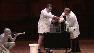 During a science break for the 2014 Ig Nobel Awards ceremony on Sept. 18, presenters create a gelatin substance while a "human sparkplug" looks on. 