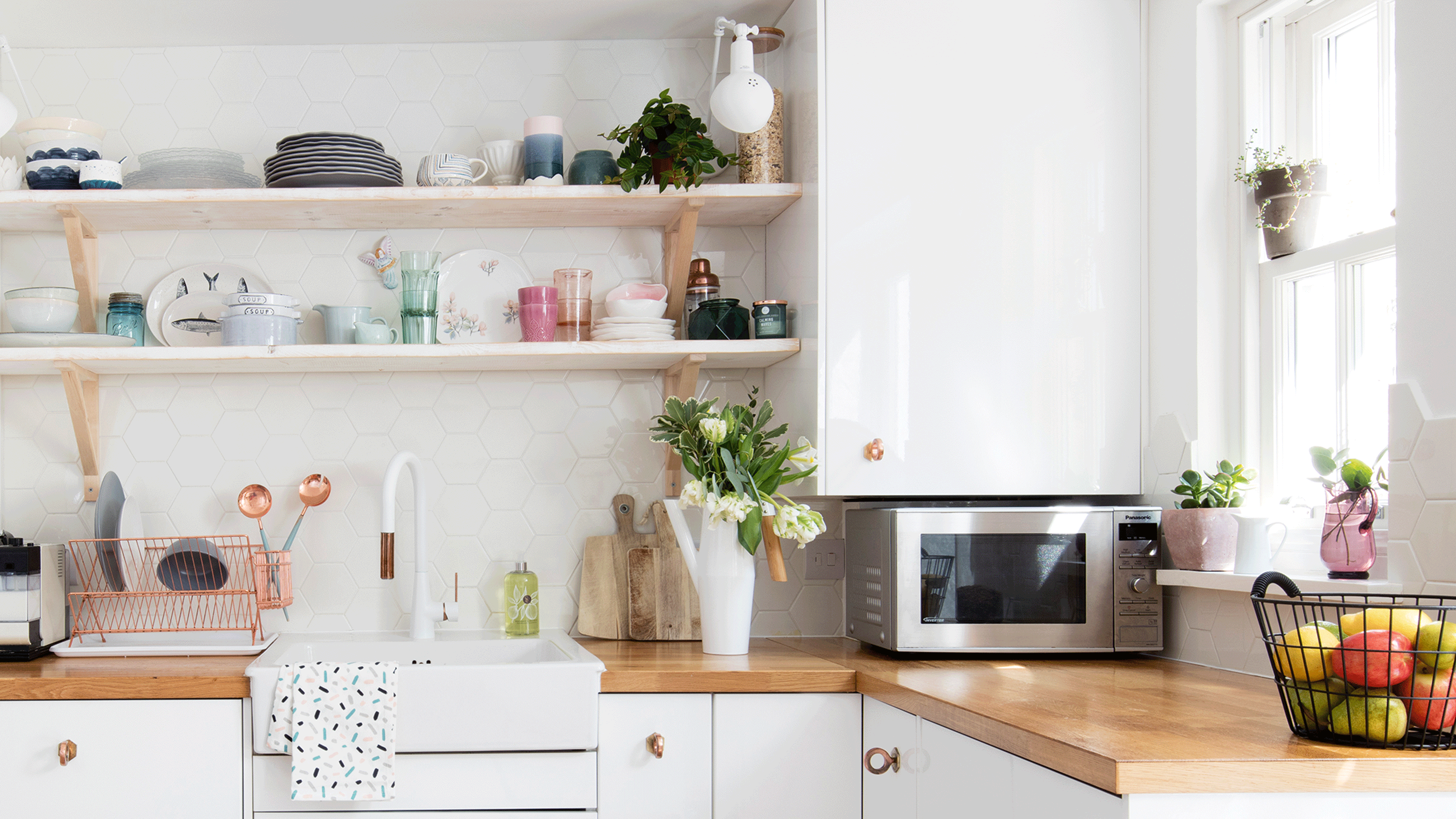 White kitchen with tiles and cooker