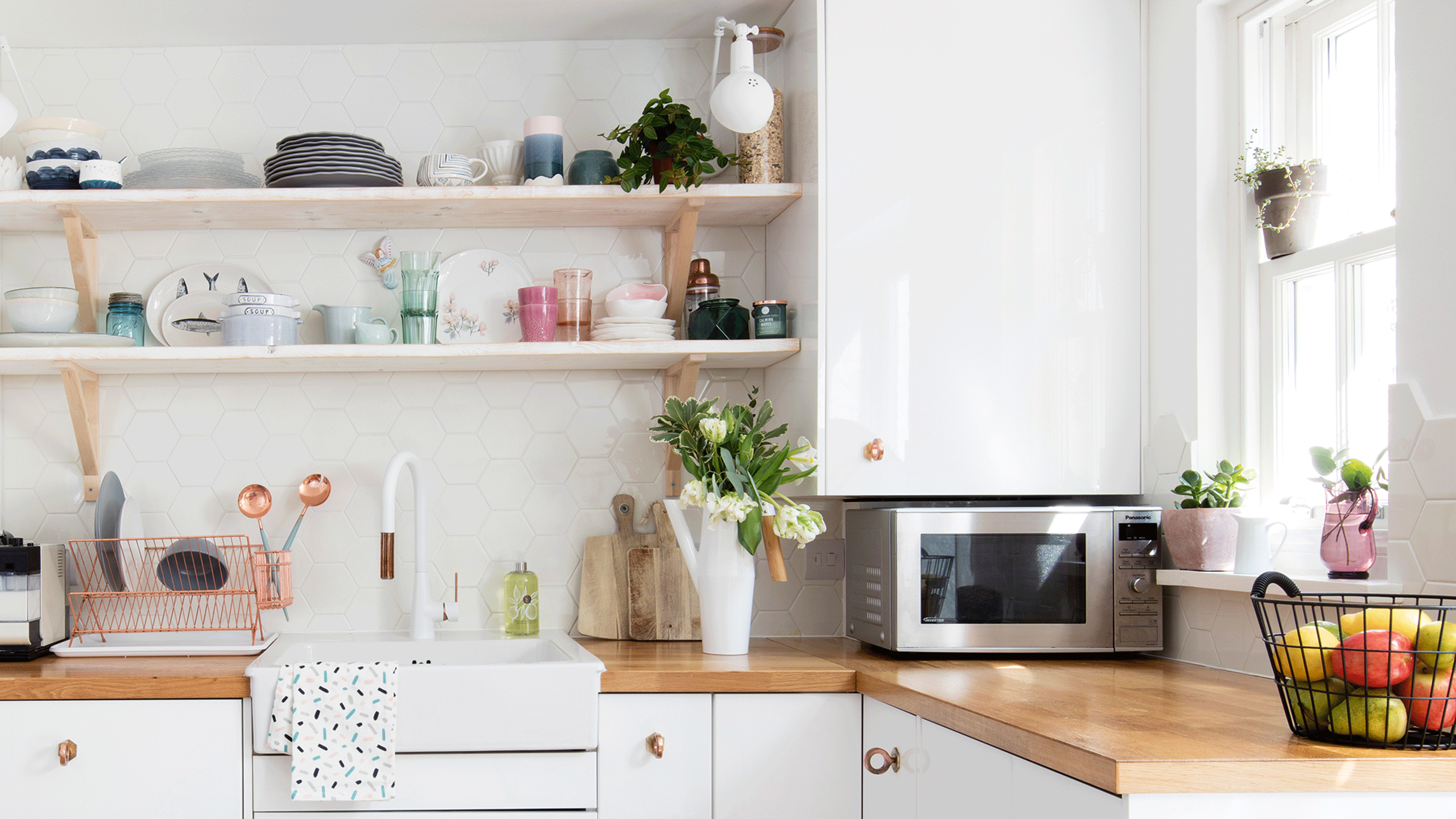 Sink with black taps and white metro tiled splashback