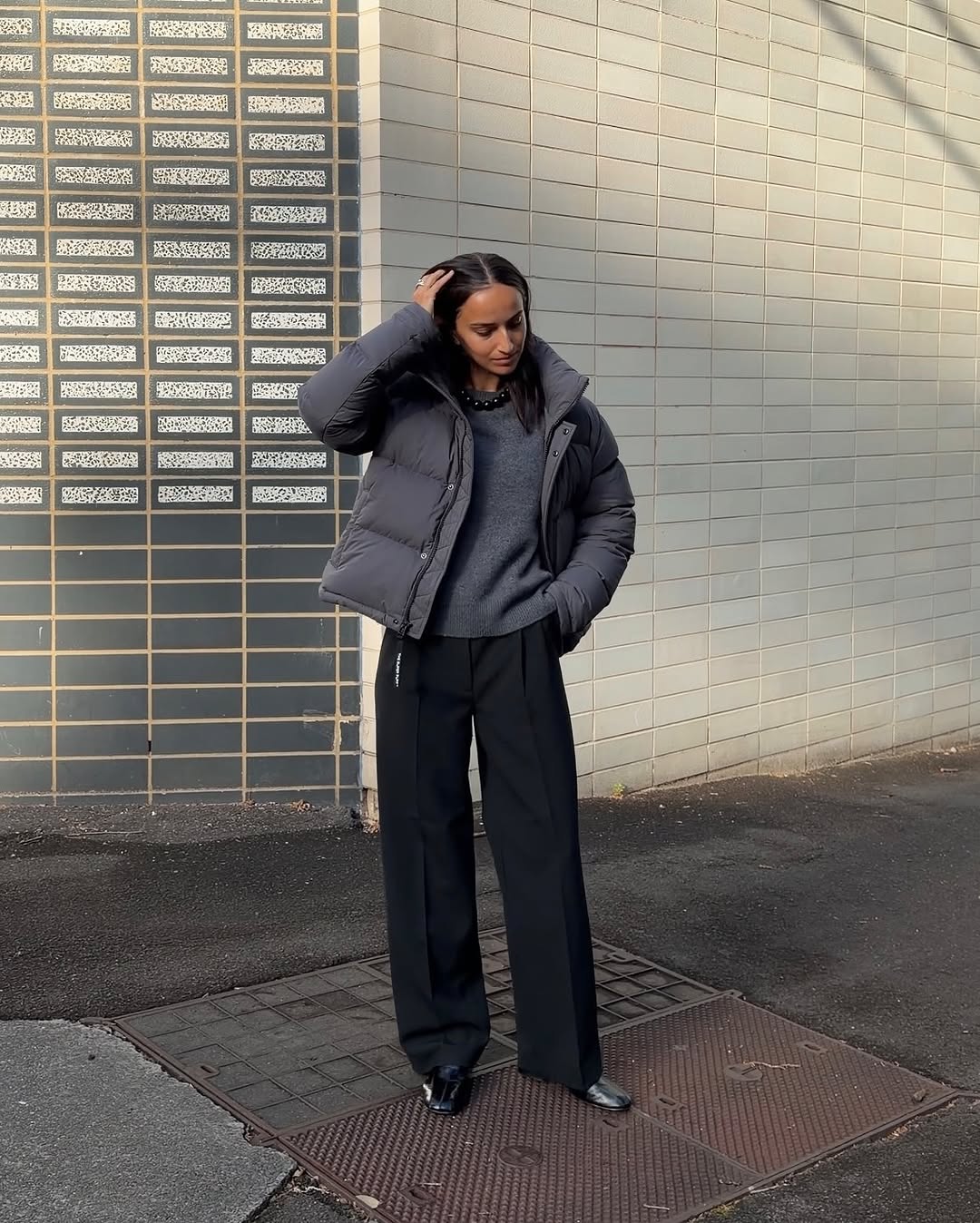 woman wearing wearing puffer coat outfit 2025