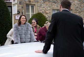 Chas and Liam talk across bonnet of the white limo