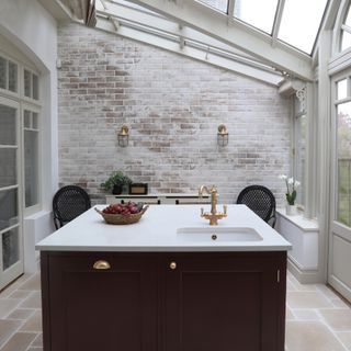 burgundy kitchen island with white quartz worktop