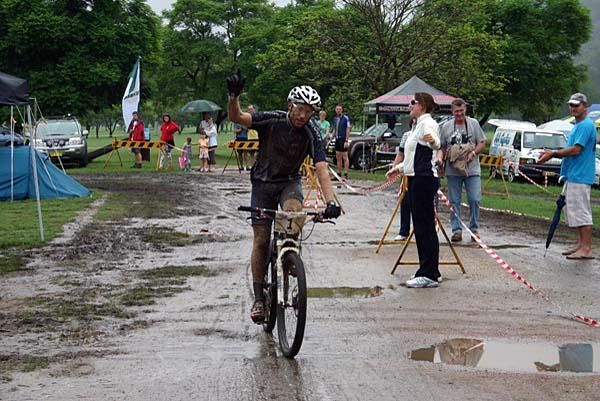 A muddy Jason English wins the Jetblack 24-hour race, which was shortened due to conditions.