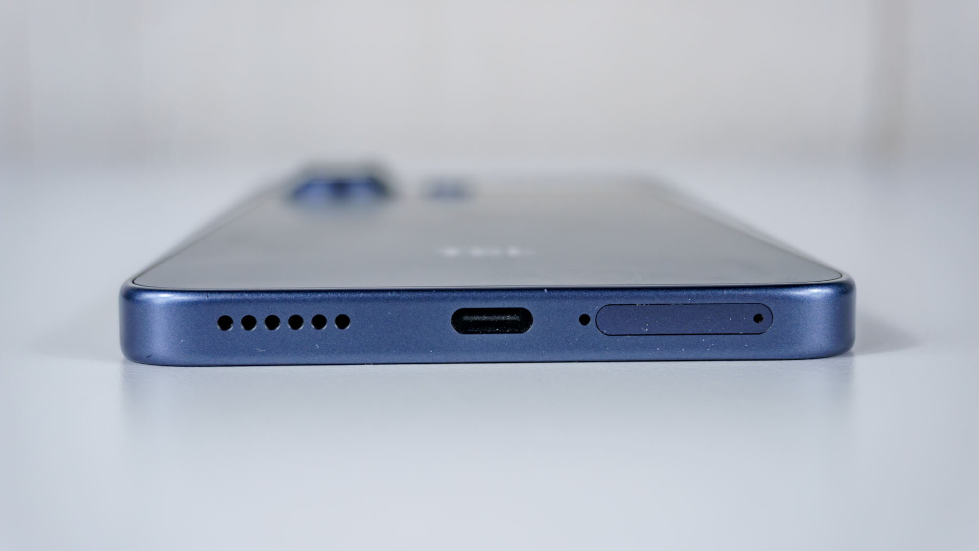 A close-up shot showing off the TCL NXTPAPER 70 Pro's USB-C port and SIM card slot