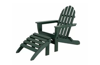 A dark green Adirondack chair with footstool